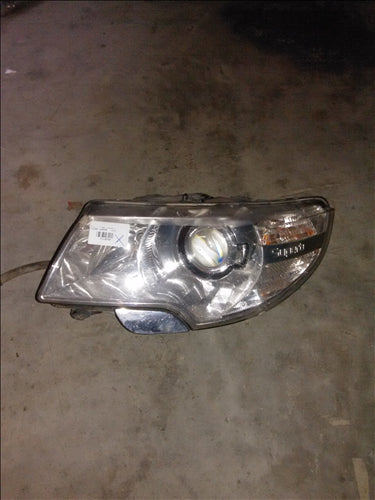 far stanga xenon Skoda Superb an 2010